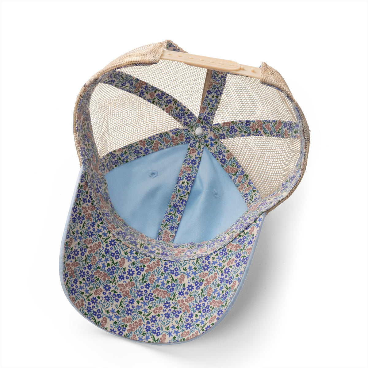 Floral-patterned cap with mesh back on a white background