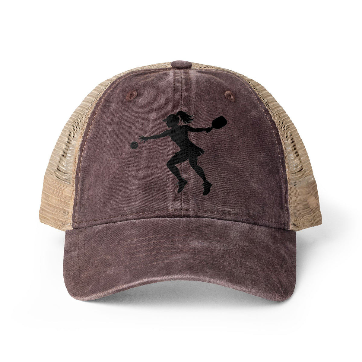 A distressed trucker hat with a dark brown front panel and beige mesh back, featuring a black silhouette graphic of a female pickleball player on the front, shown on a white background.