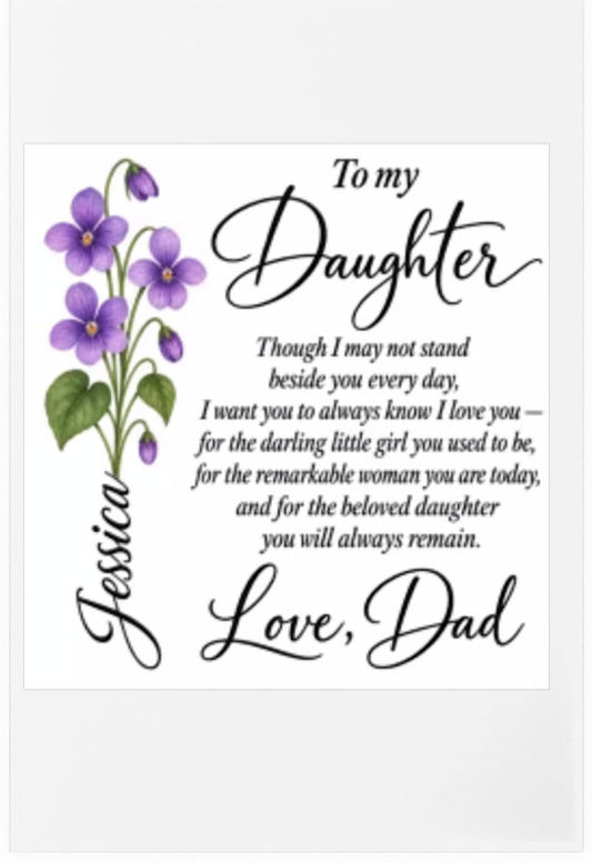 A personalized acrylic plaque on a plain wooden stand featuring a purple flower illustration and a sentimental poem addressed to a daughter, with the name 'Jessica' written vertically in script.